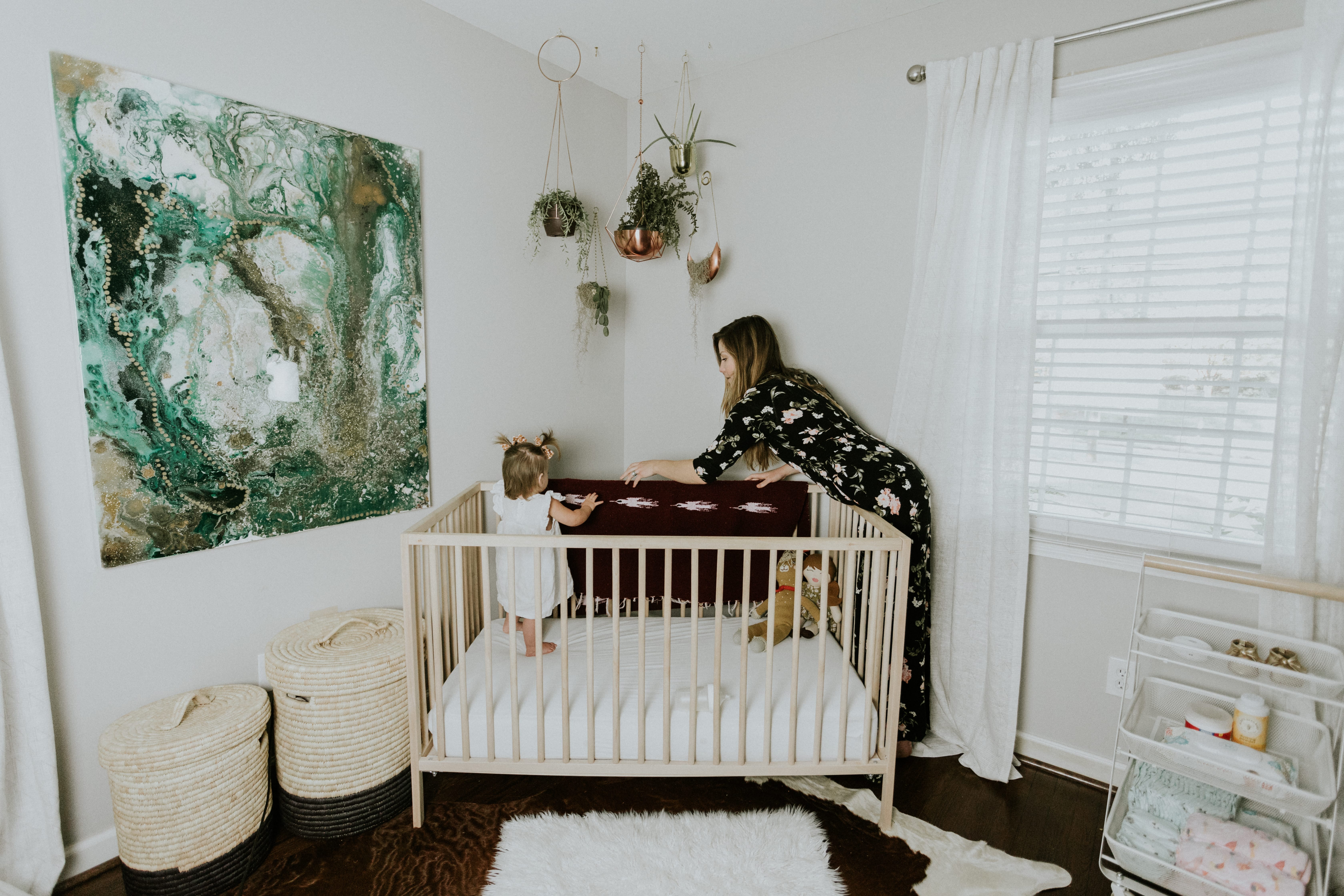 a view of the crib and the custom art piece from Jill Gordon Ford art and the Havenly which completed our Modern Nursery