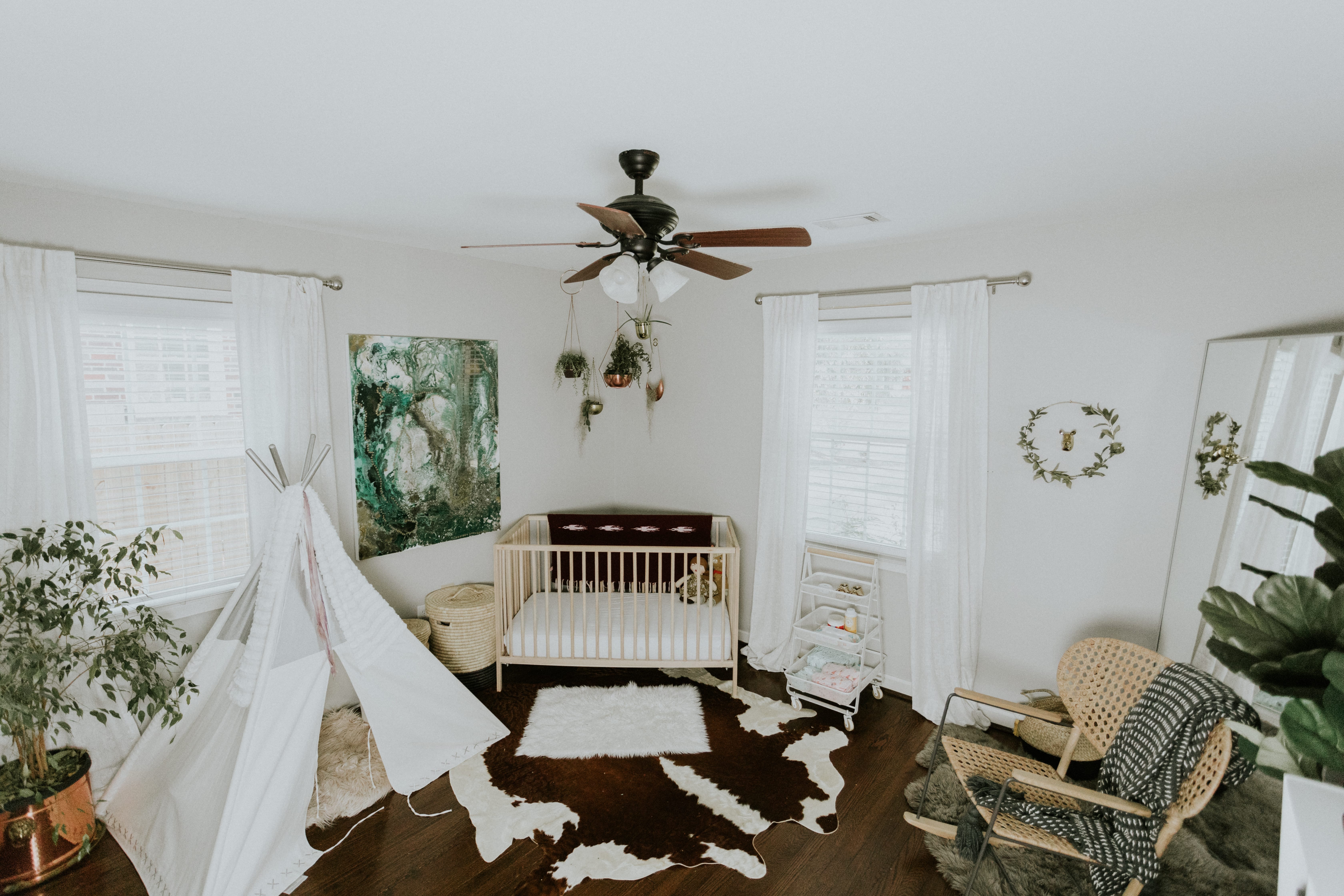 A bird's eye view of the modern nursery featuring beautiful custom art and lots of plants